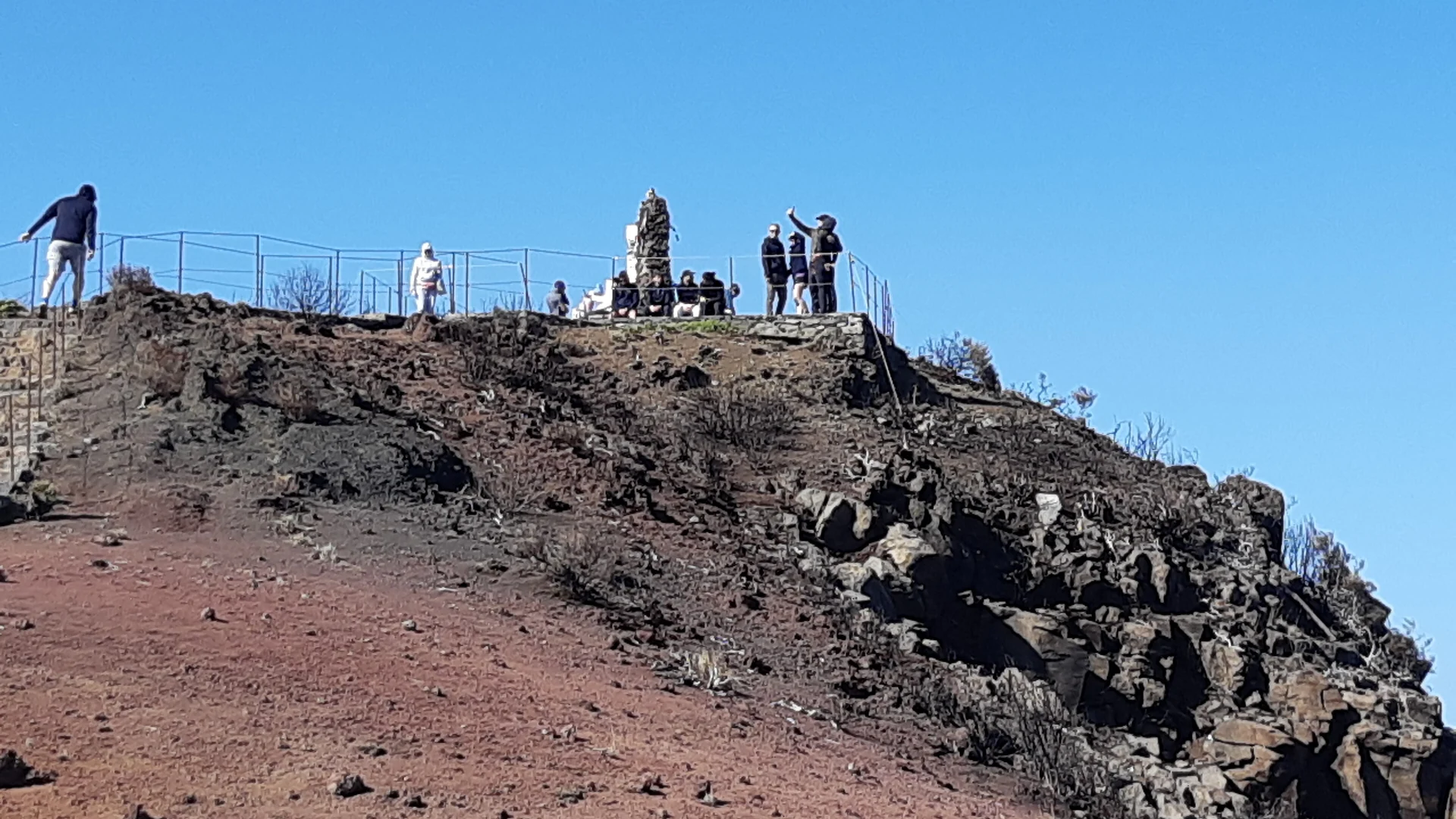 Hikers at the summit viewpoint on the Pico Ruivo trail in Madeira's central peaks