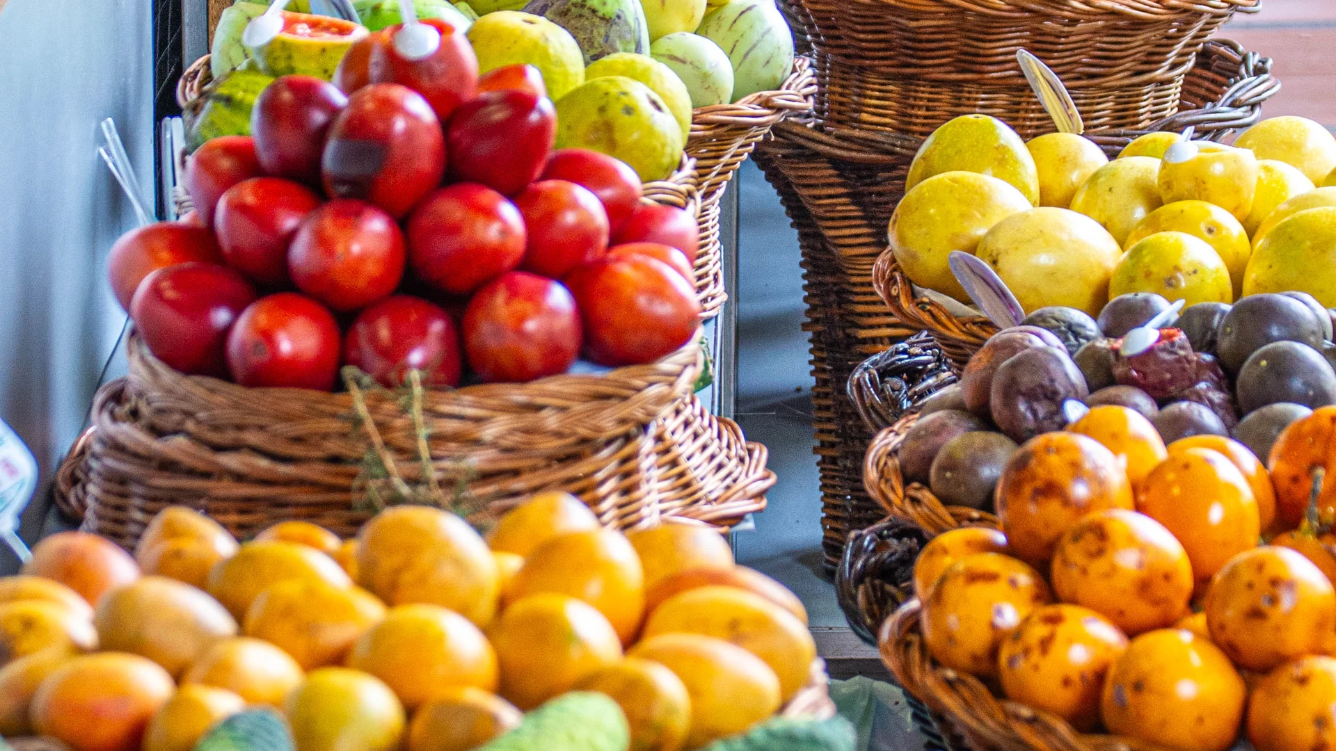 Baskets of tropical fruit on a market stall in Funchal, Madeira