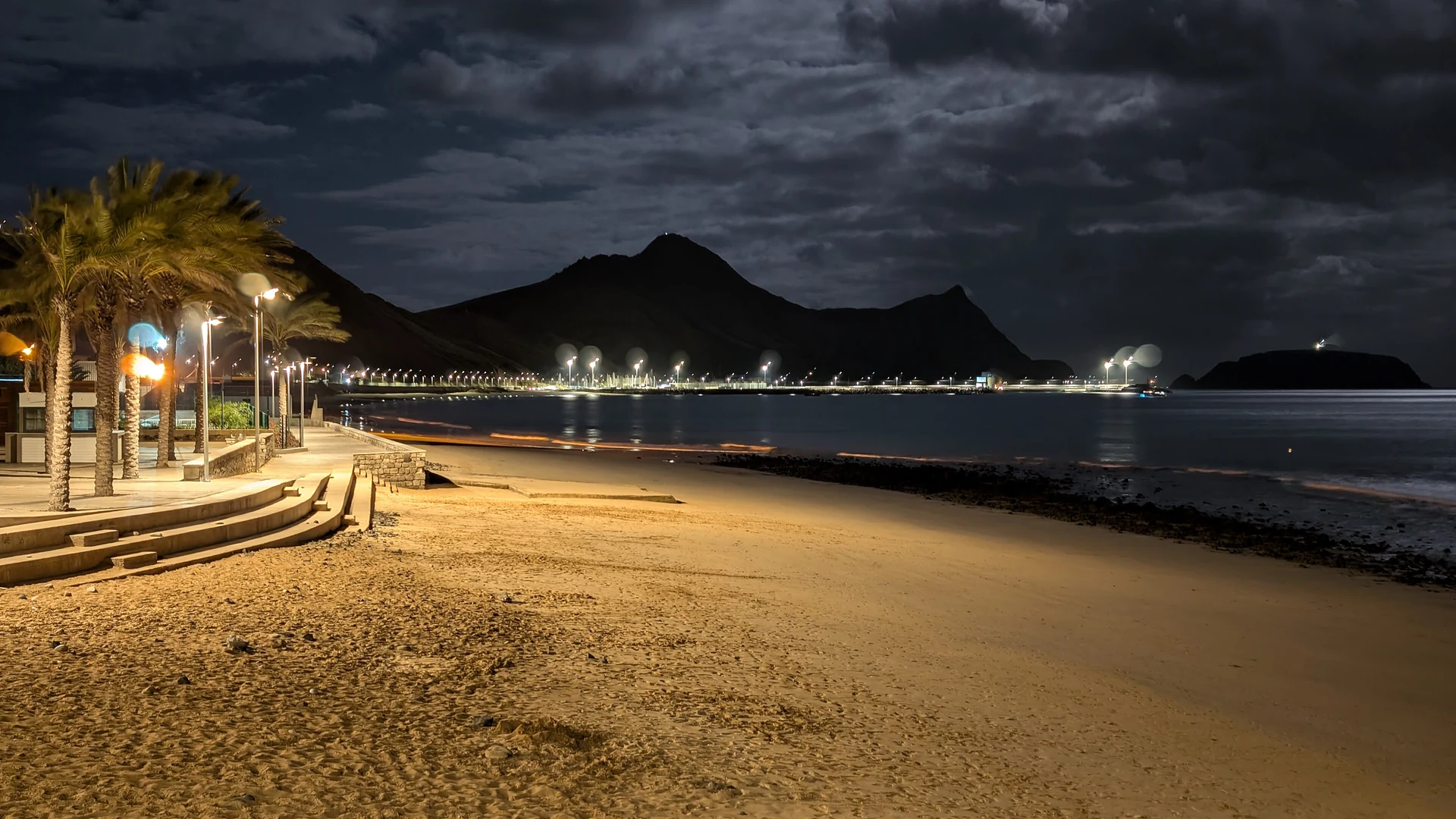 The Porto Santo beach and lit seafront promenade at night, Madeira